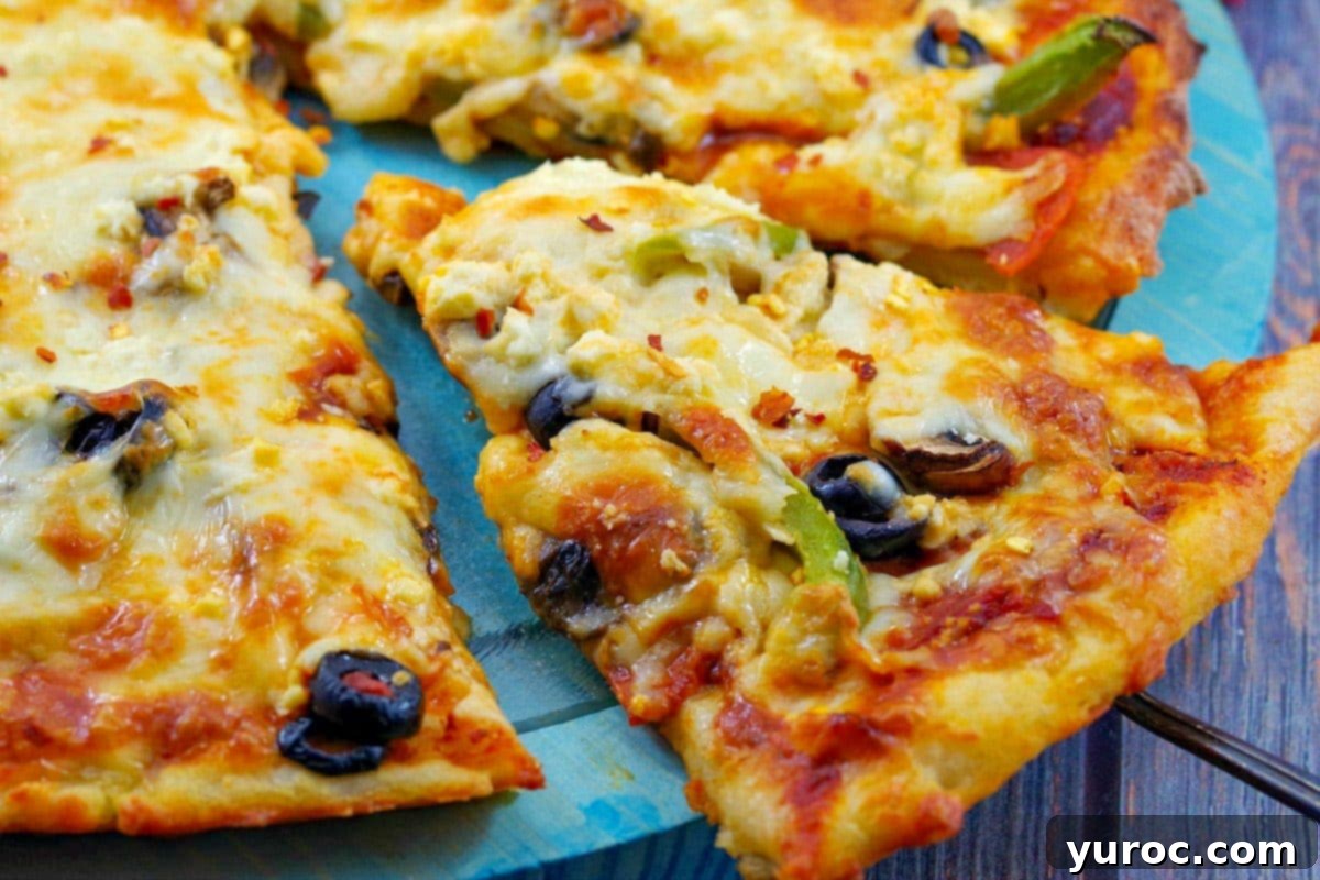 slice of weight watchers pizza being lifted off a blue pizza plate