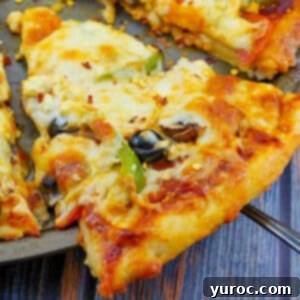 slice of weight watchers pizza being lifted off a pizza pan