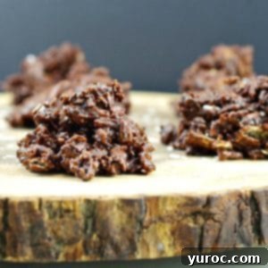 Chocolate cereal clusters on a wooden tree trunk platter
