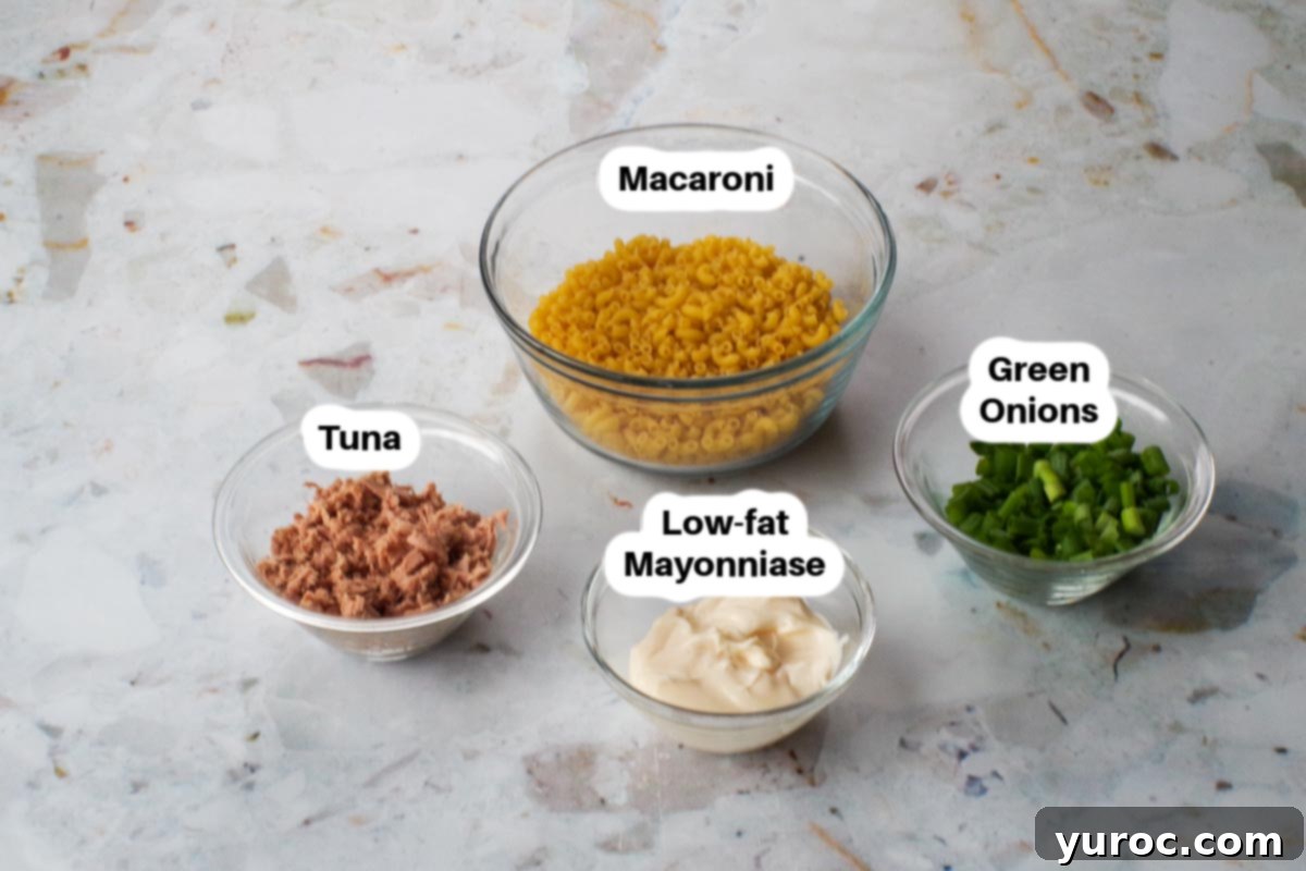 Wholesome Tuna Macaroni Salad 3 Ingredients in Healthy Tuna Macaroni Salad in white bowls, labelled.