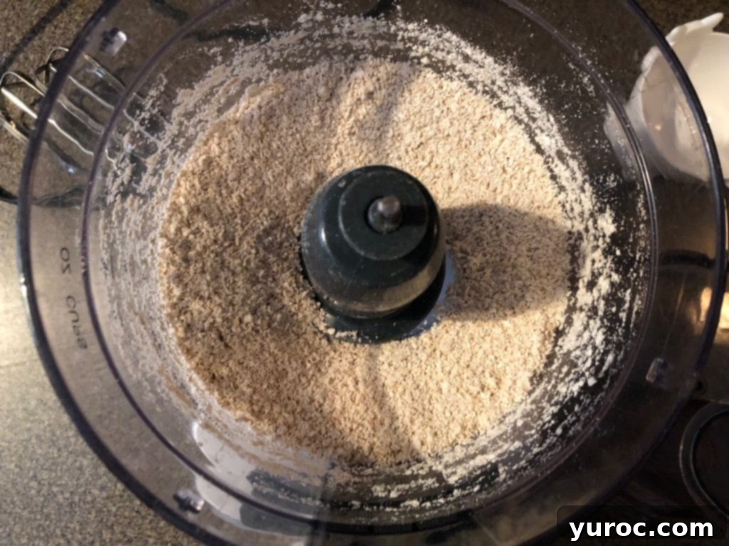 Oats being ground for IHOP copycat pancakes in a food processor
