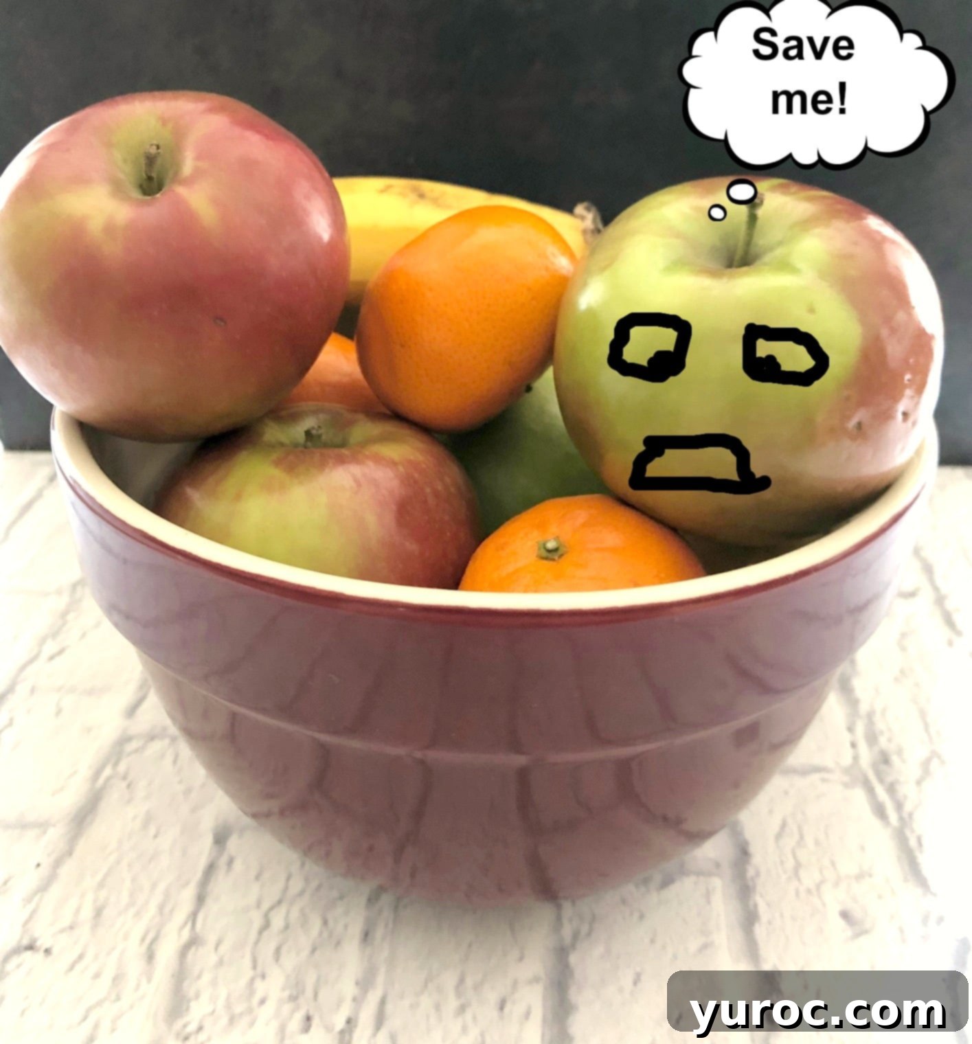 Warm Apple Cinnamon Topping 8 A whimsical image of fruit in a bowl, with an apple displaying a hand-drawn distressed face and a word bubble saying 'save me', humorously illustrating the plight of overripe fruit.