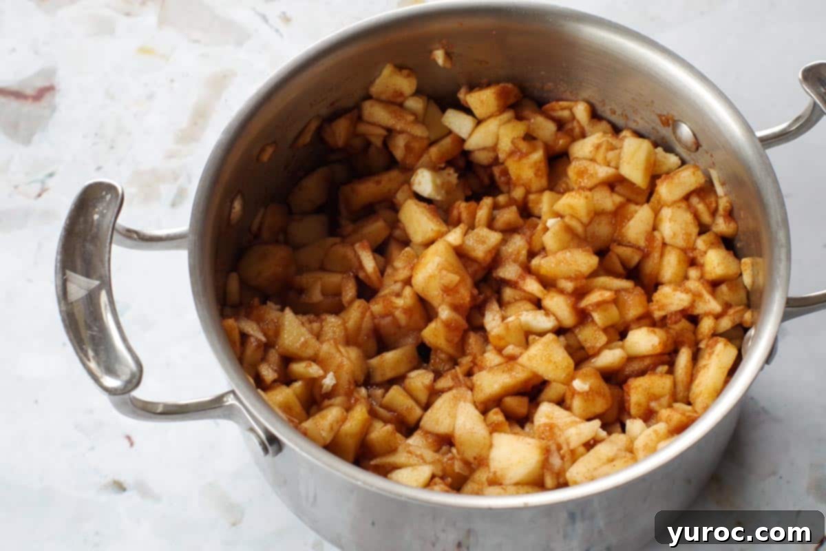 Warm Apple Cinnamon Topping 3 All diced apples and other topping ingredients are combined in a medium saucepan before cooking.