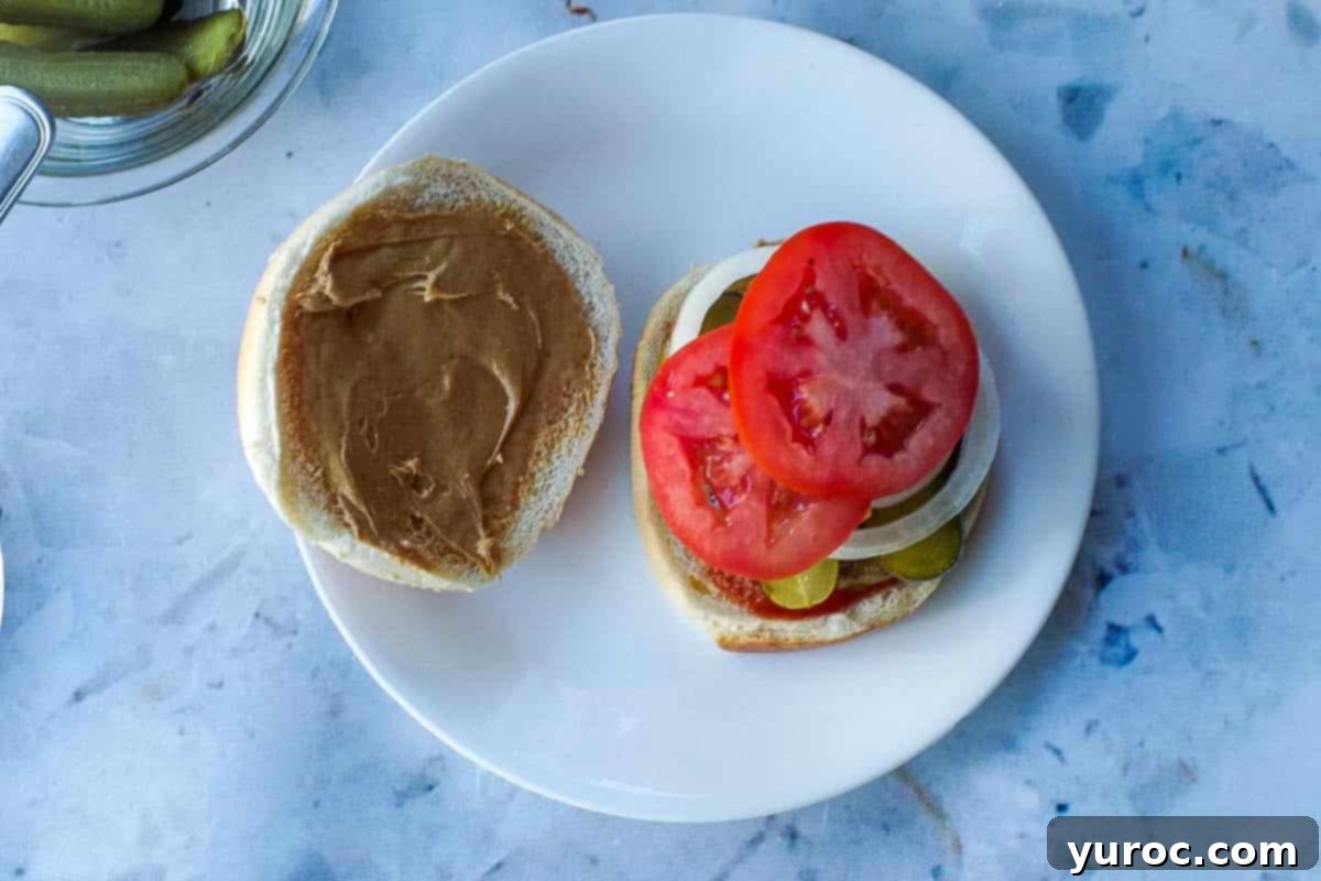 Peanut butter added to the inside of the top of the bun.