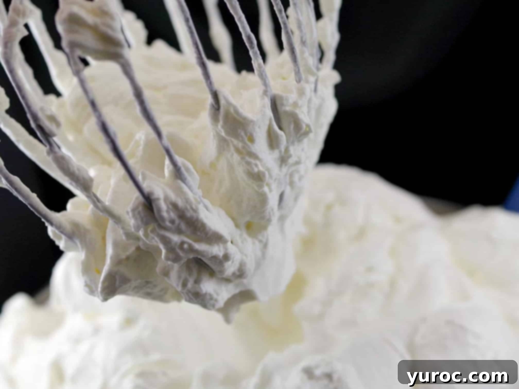 No Churn Potato Cookies and Cream Delight 8 whipped cream on a stand mixer whisk over a bowl of whipped cream