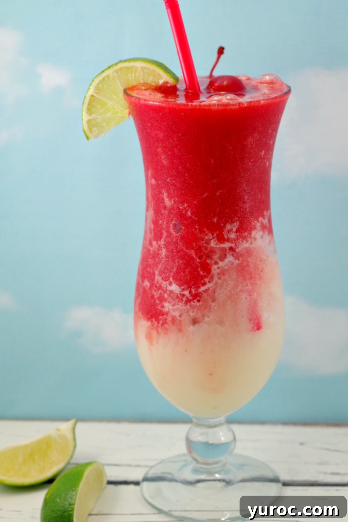 Miami Vice Mocktail with lime and cherry garnish