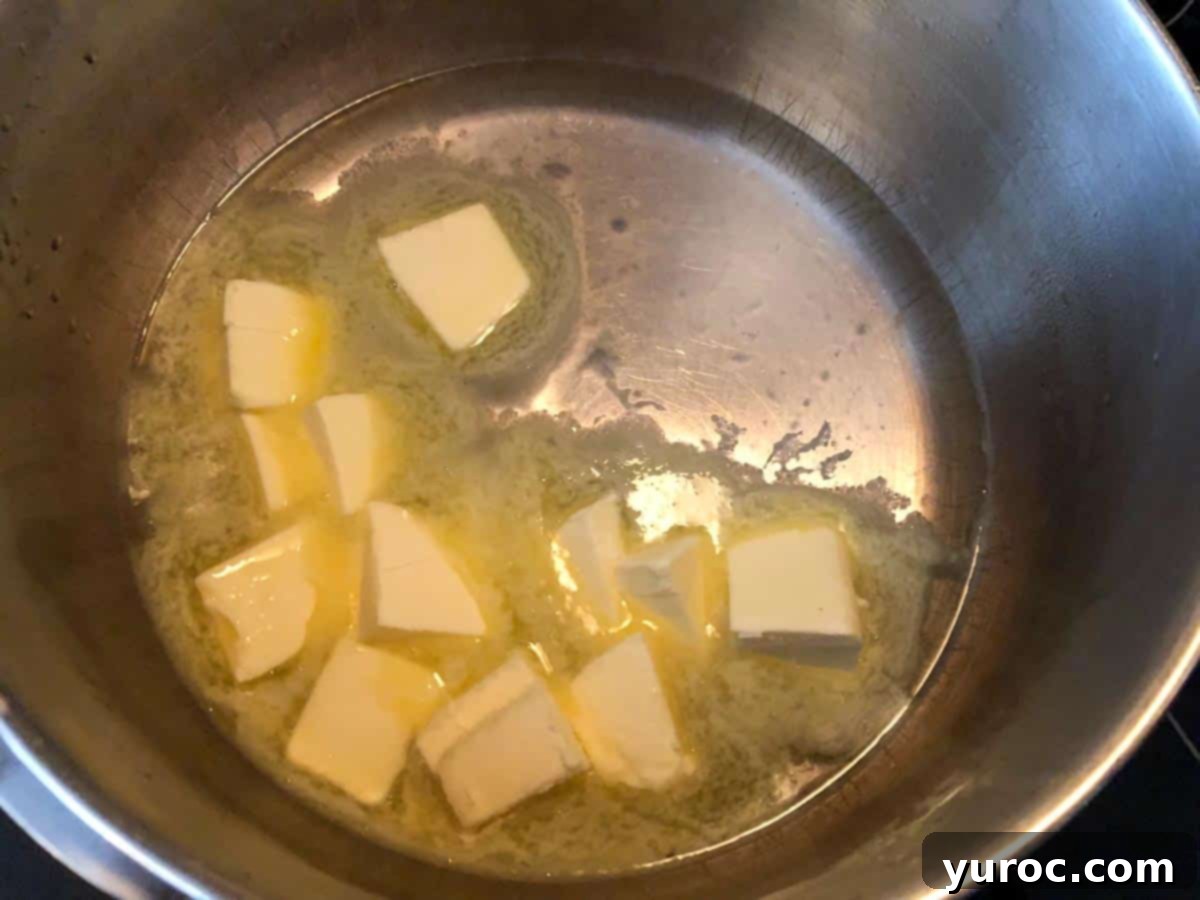 Butter and boiling water in pot.