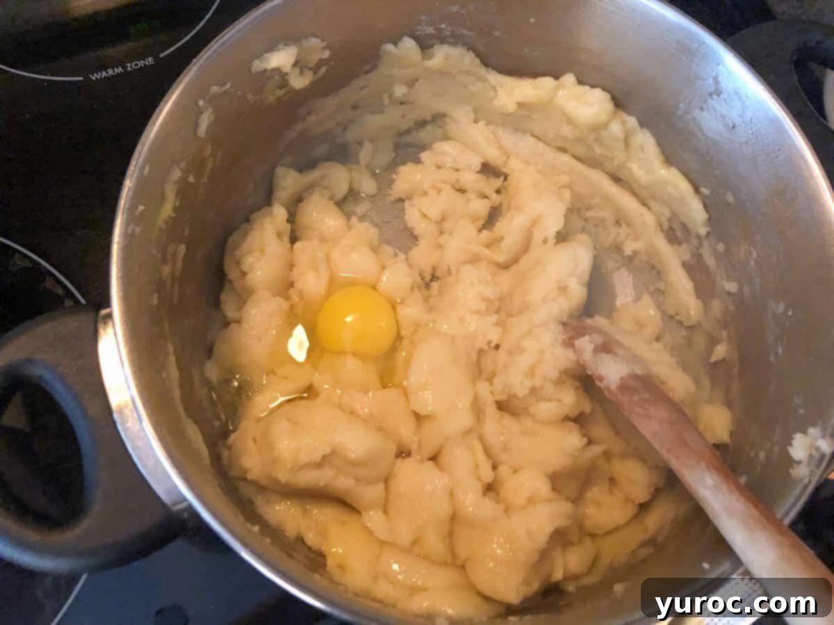 Egg added to pastry mixture.