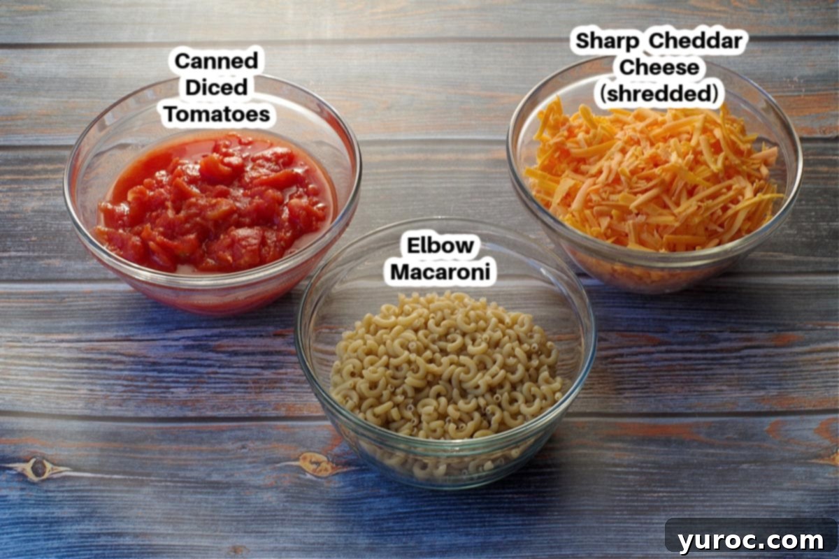 ingredients in macaroni and cheese with tomatoes labelled in glass bowls