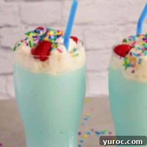 Two Blue Raspberry Slushie drinks, garnished and ready to be served.