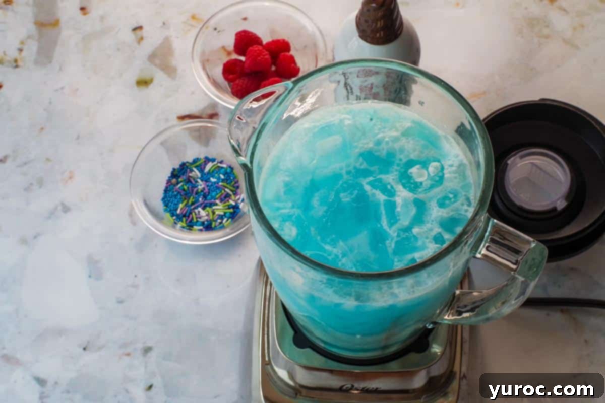 Blue Raspberry Slushie ingredients added to a blender, ready for blending.