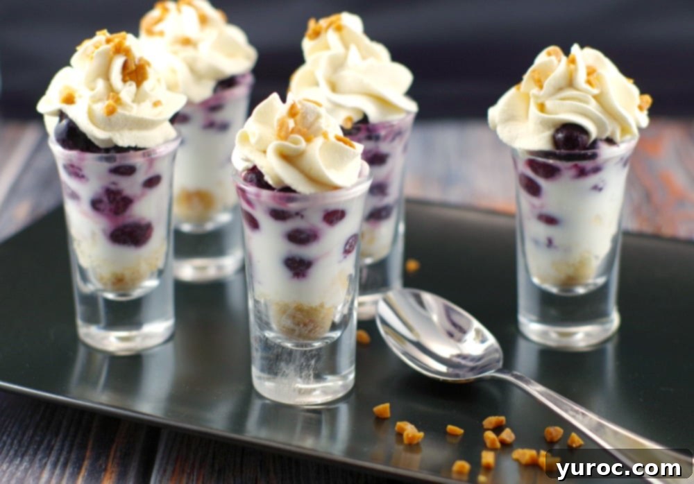 Elegant Saskatoon Berry Tiramisu Dessert Shooters, also known as Juneberry recipe from Foodmeanderings.com, presented beautifully.
