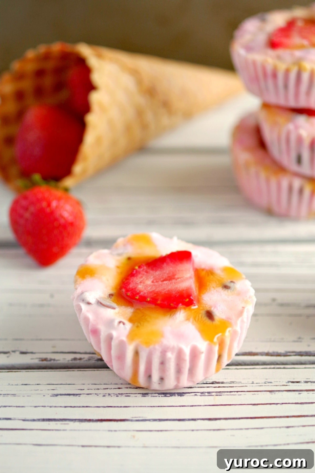 Strawberry Cone Crunch Frozen Yogurt Cups 11 Strawberry Drumstick Frozen Yogurt Cups on white table with strawberries and cones in background