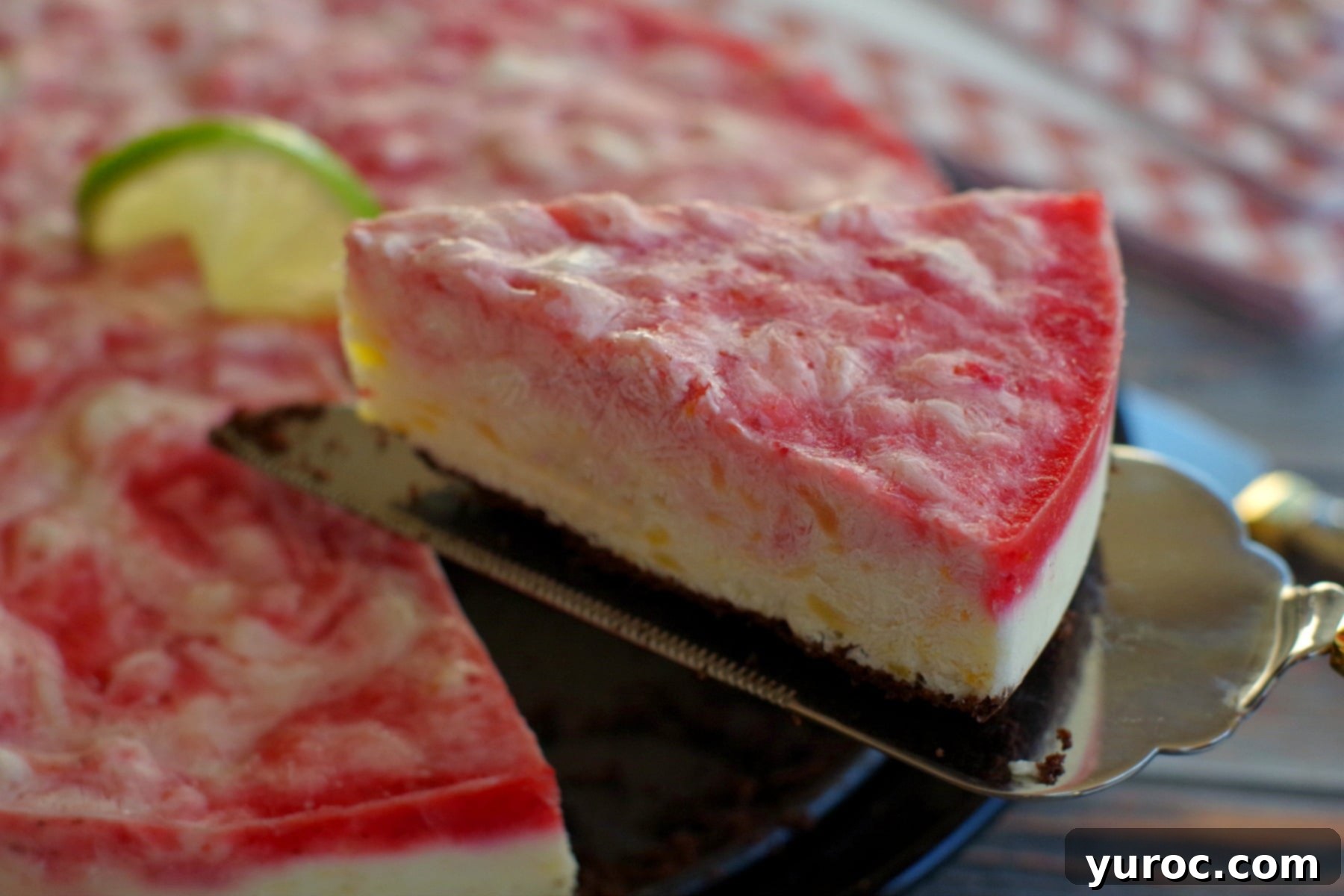 A whole Miami Vice Frozen Cheesecake, beautifully swirled and ready to be served, symbolizing a perfect blend of two iconic frozen drinks.