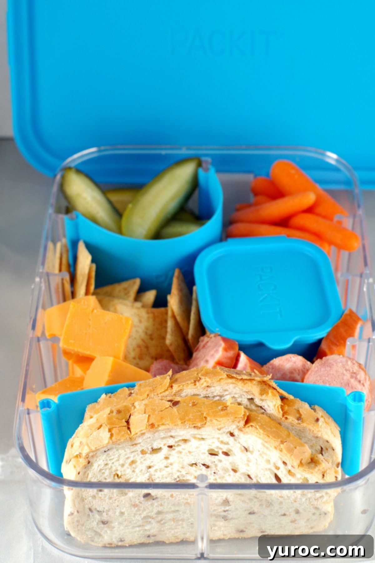 This bento box idea is a quick and easy cold meal of Ukrainian sausage (kubasa/kielbasa), cubed cheddar cheese, sliced dill pickles, rye bread, crackers, mustard and baby carrots. It's just like the late night snack you'd have at a social! #bentobox #lunchbox #ukrainian