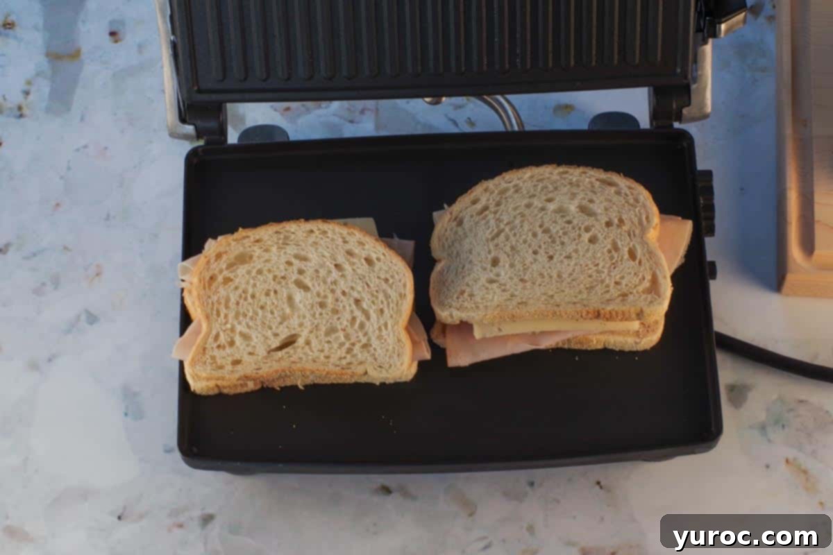 Sandwiches placed on panini grill 2 at a time.