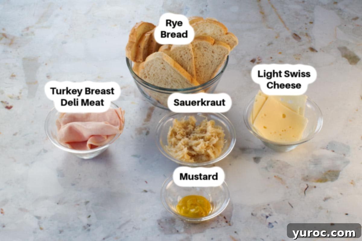 Ingredients in a Turkey Reuben Panini in glass bowls, labelled.