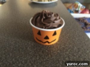 cupcake places inside orange cup, ready for handle and topping