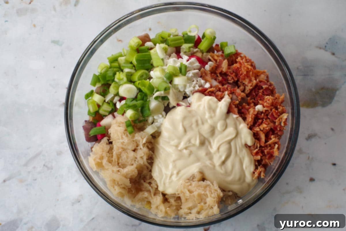 Signature Pierogi Potato Salad 11 Remaining ingredients added to bowl with potatoes.