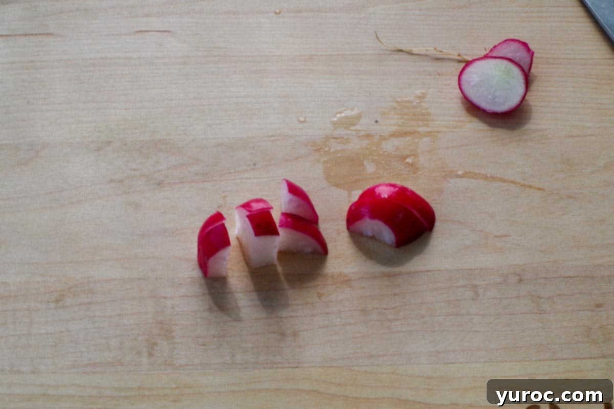 Signature Pierogi Potato Salad 7 Radishes cut on cutting board.
