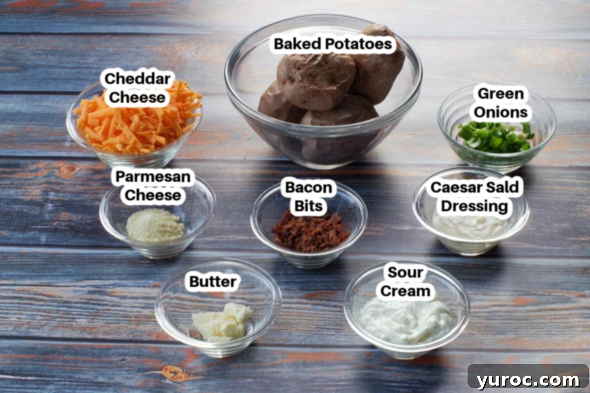 A curated display of all the key ingredients for making twice baked Caesar potatoes, neatly arranged in small glass bowls, including bacon bits, butter, sour cream, parmesan, cheddar, and freshly chopped green onions, all clearly labelled.