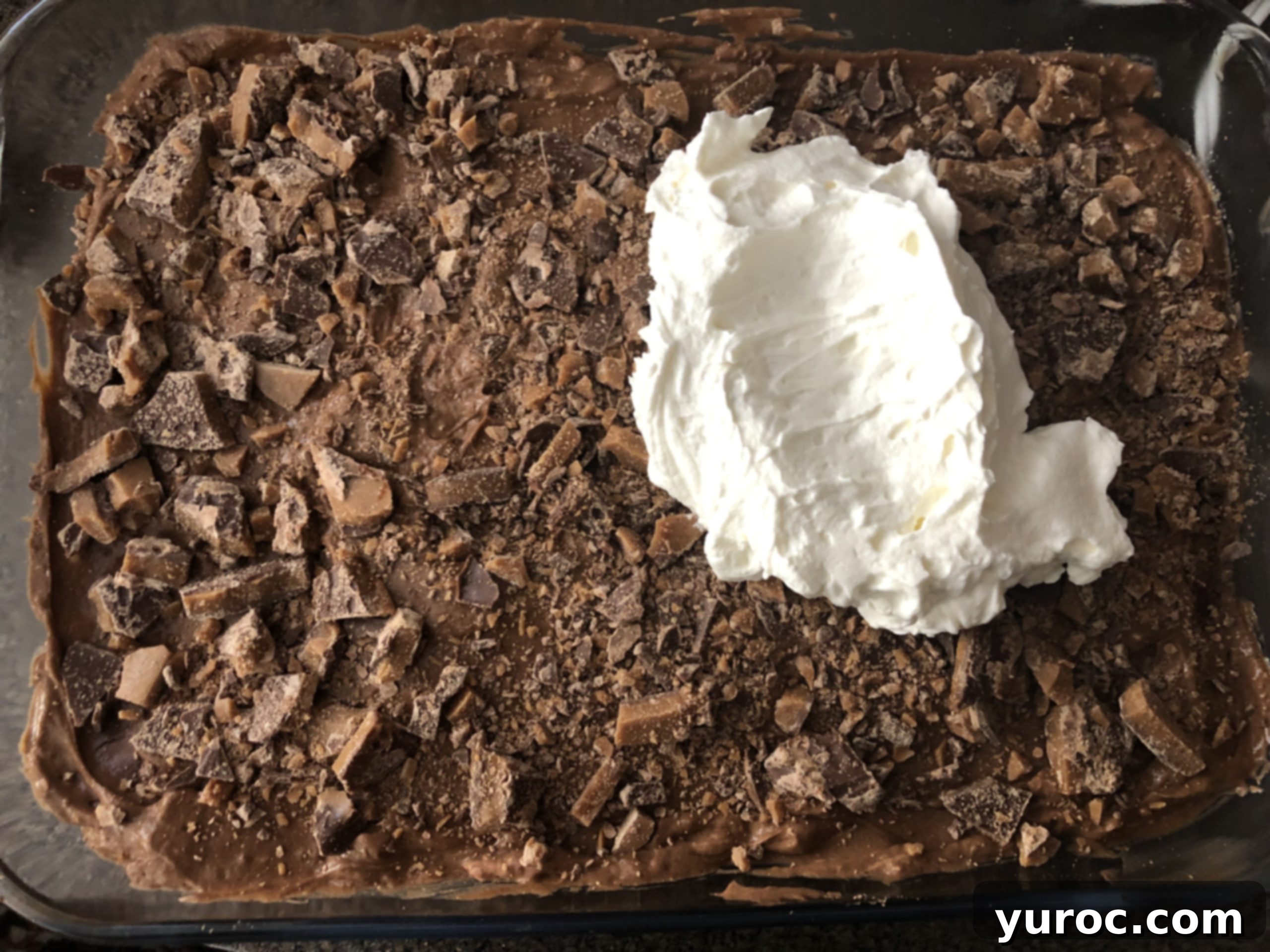 Skor Toffee Crunch Bars 5 broken skor bars added to cream cheese layer, then whipped cream being put on top, creating the final fluffy layer.