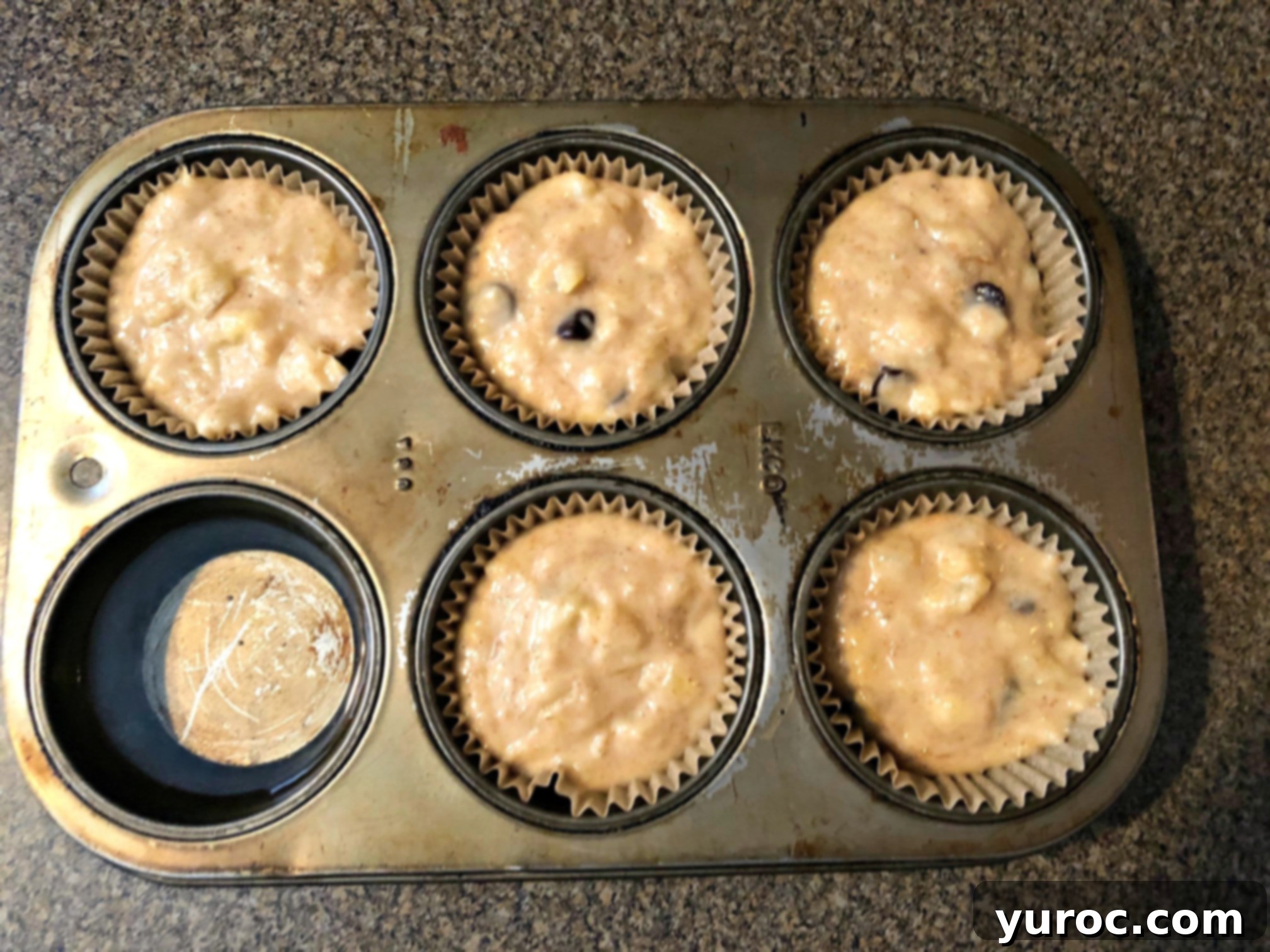 Wholesome Banana Pineapple Chocolate Chip Muffins 6 muffin tin with water added to one
