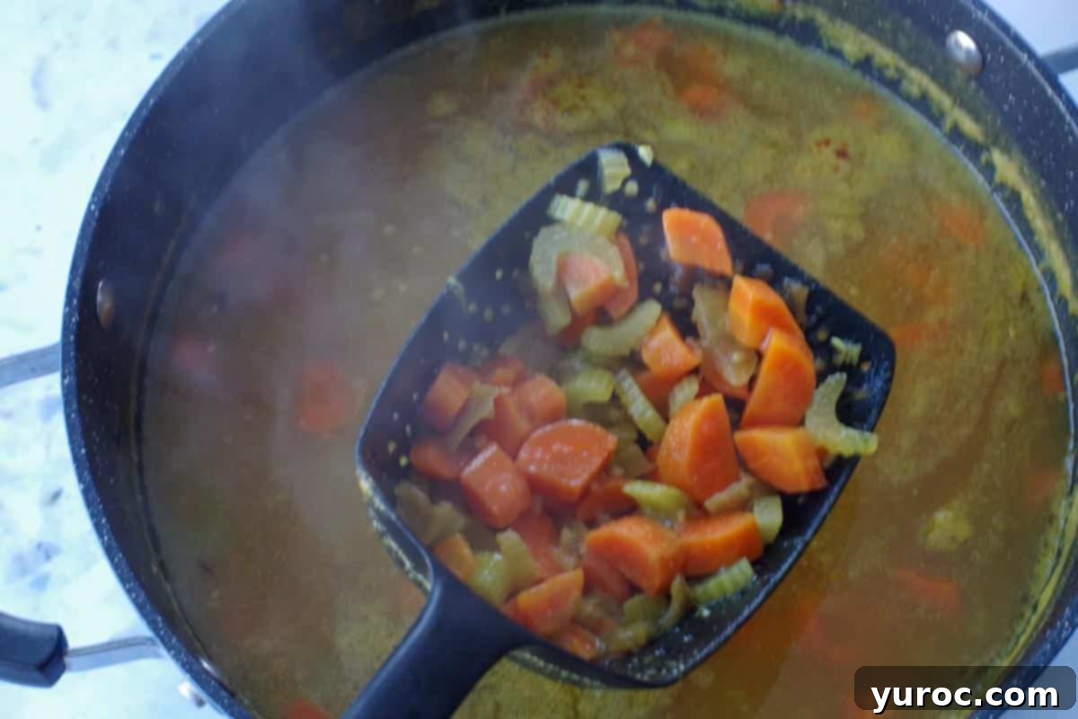 vegetables being removed with scoop and drain spoon