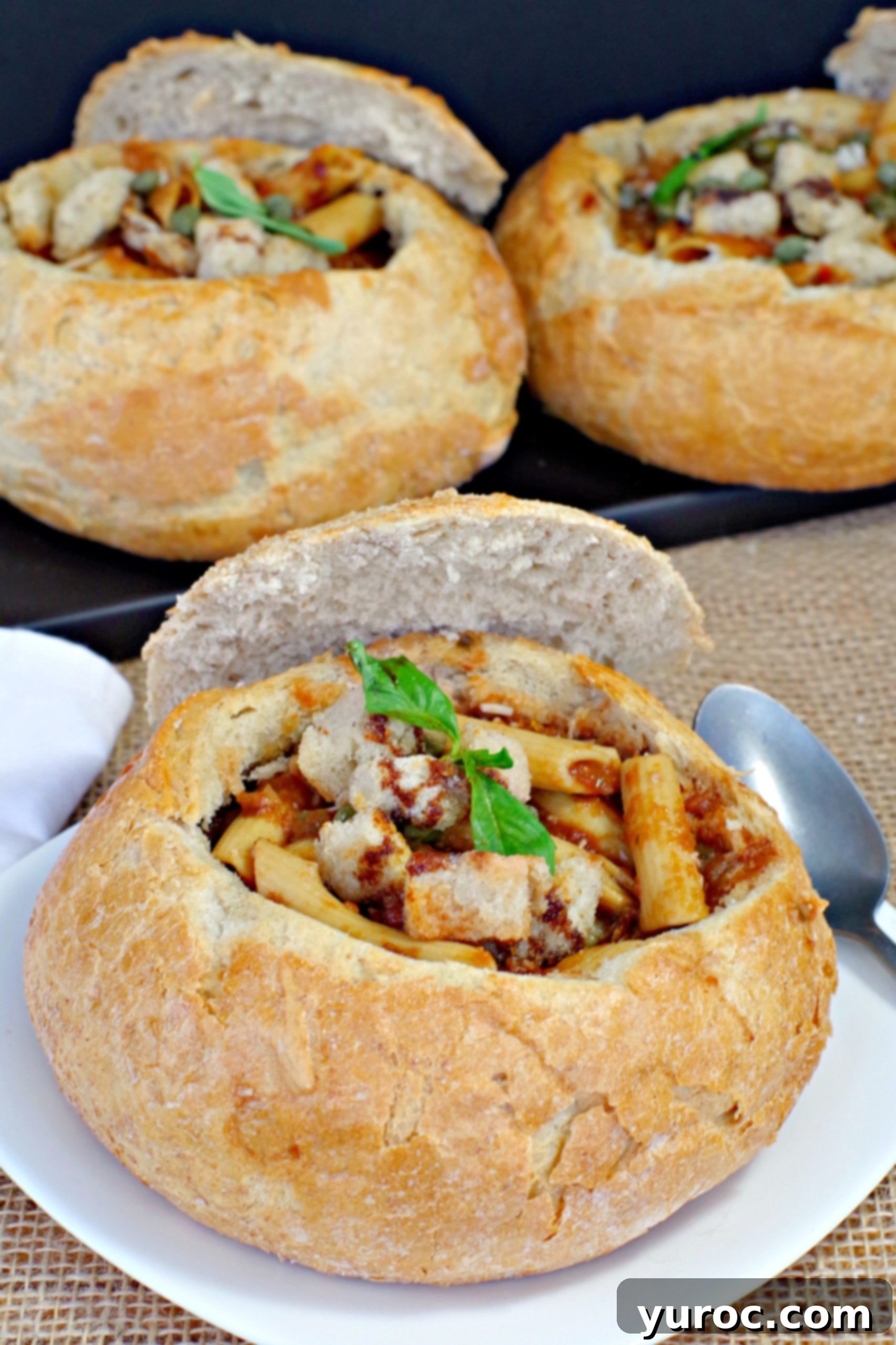 Tuscan Panzanella Pasta Soup 8 Three rustic sourdough bread bowls filled with hearty Panzanella Pasta Soup, presented on a dark tray, ready for a comforting meal.