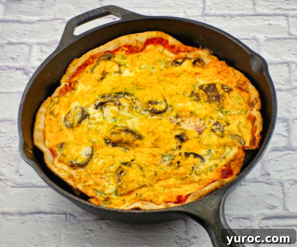whole baked healthy breakfast pizza in cast iron frying pan
