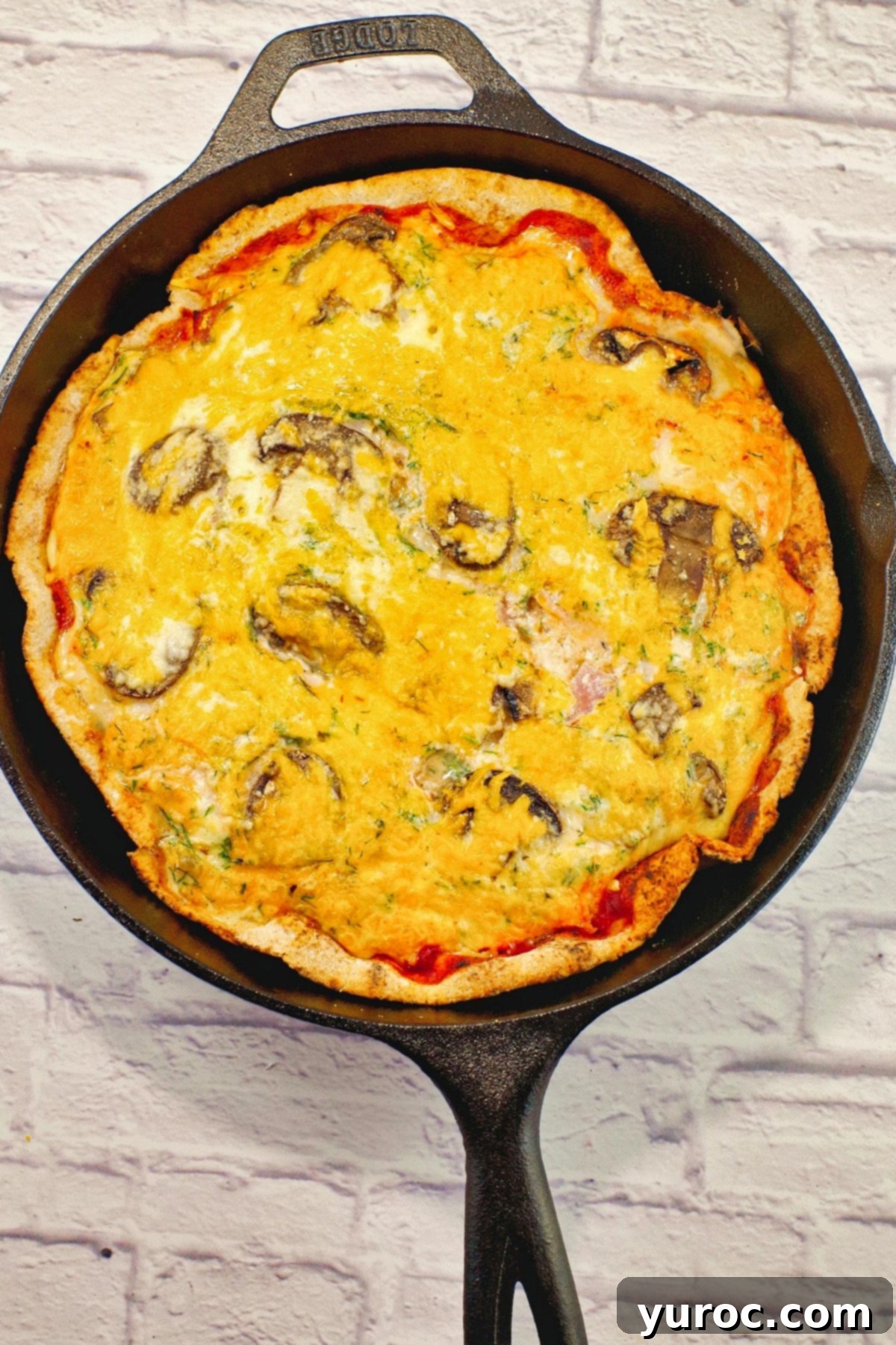 whole egg white pizza in cast iron frying pan