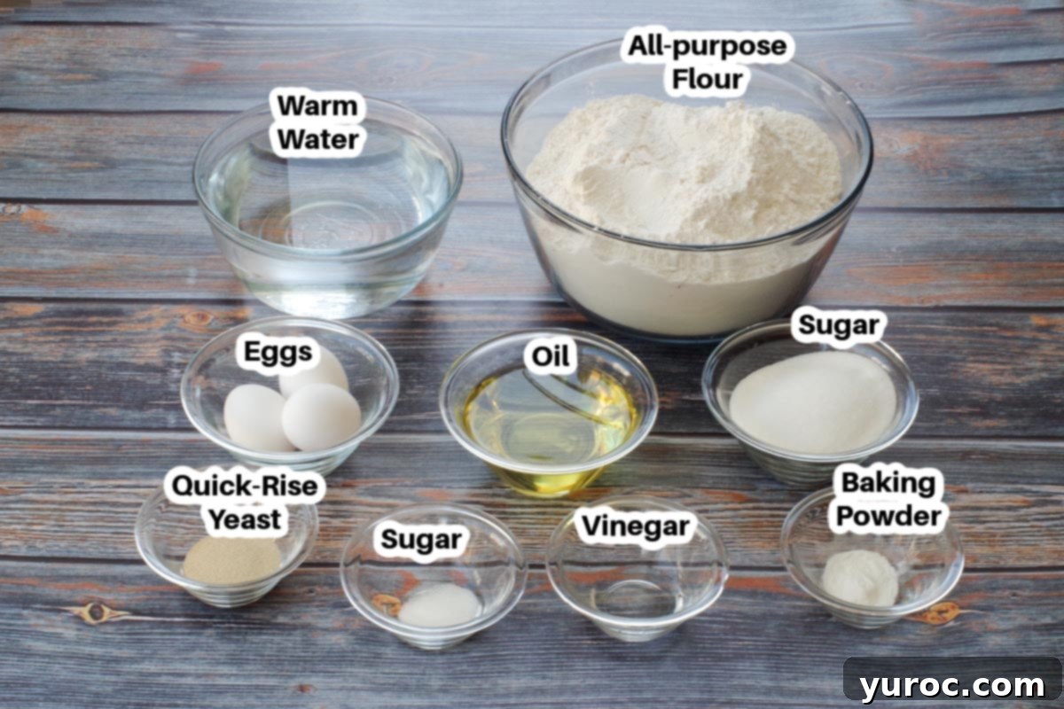 Various ingredients for Granny Buns in glass bowls, neatly labelled, on a rustic faux wood surface