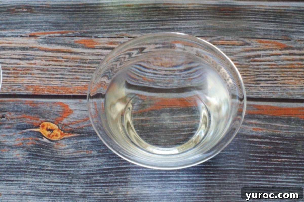 1 teaspoon sugar dissolving in 1 cup of warm water in a clear glass bowl