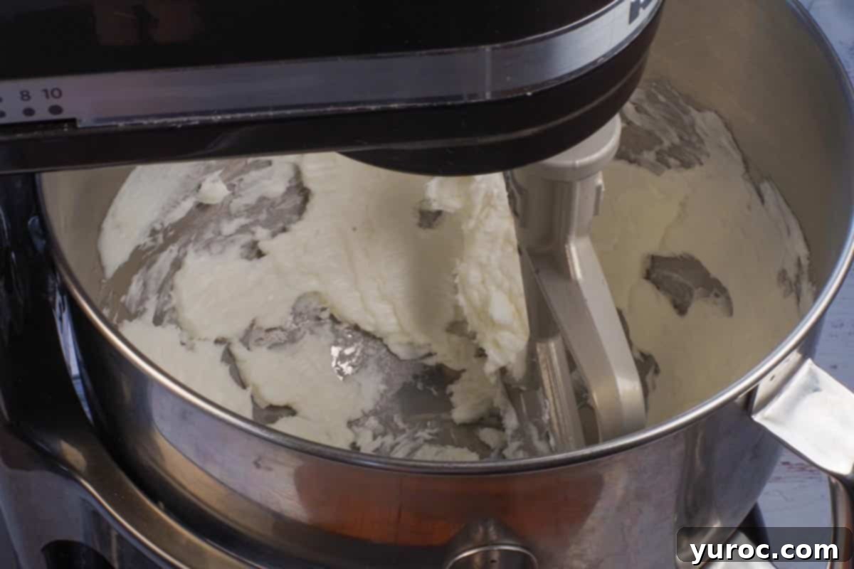 shortening being whipped in a stand mixer bowl