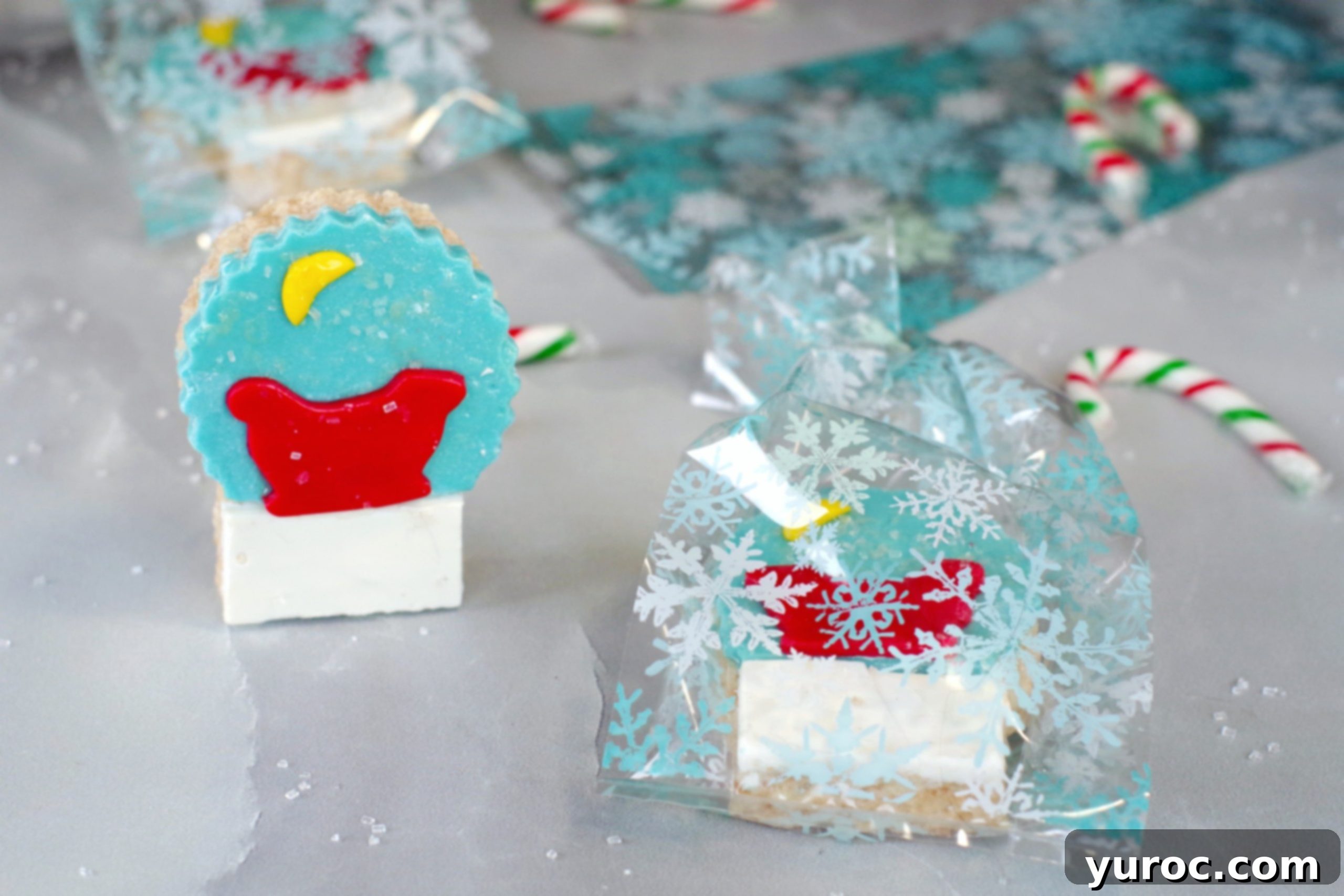 Festive Snow Globe Krispies 5 A festive Snow Globe Cereal Treat packaged in a clear snowflake bag, with more treats in the background, ready for gifting.