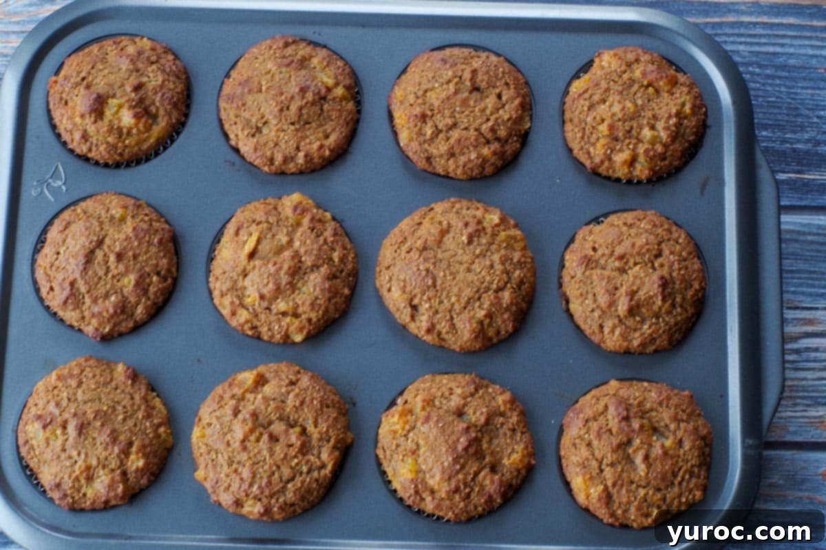 baked bran pumpkin muffins in muffin tin