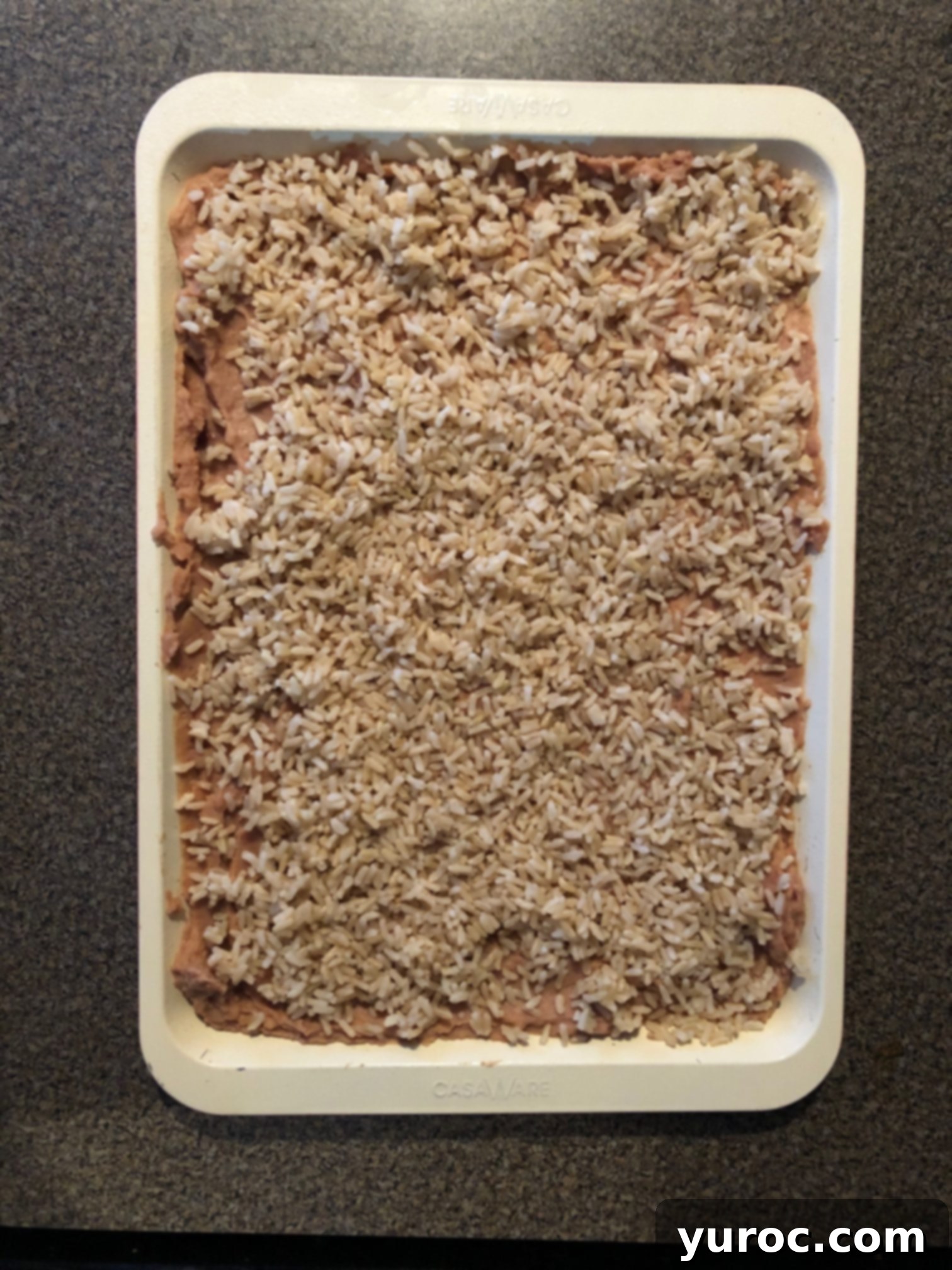 One-Pan Veggie Huevos Fiesta 7 rice added to sheet pan huevos rancheros