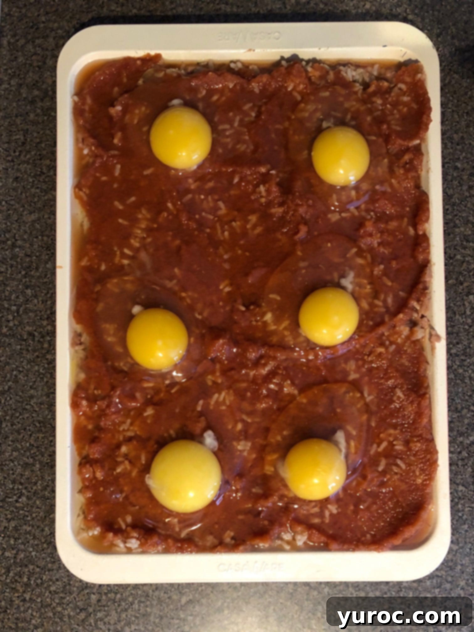 One-Pan Veggie Huevos Fiesta 10 eggs cracked onto sheet pan huevos rancheros