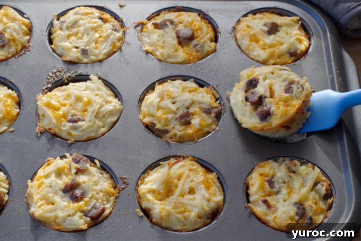brunch bites in muffin tin, with one being lifted out with a blue spatula