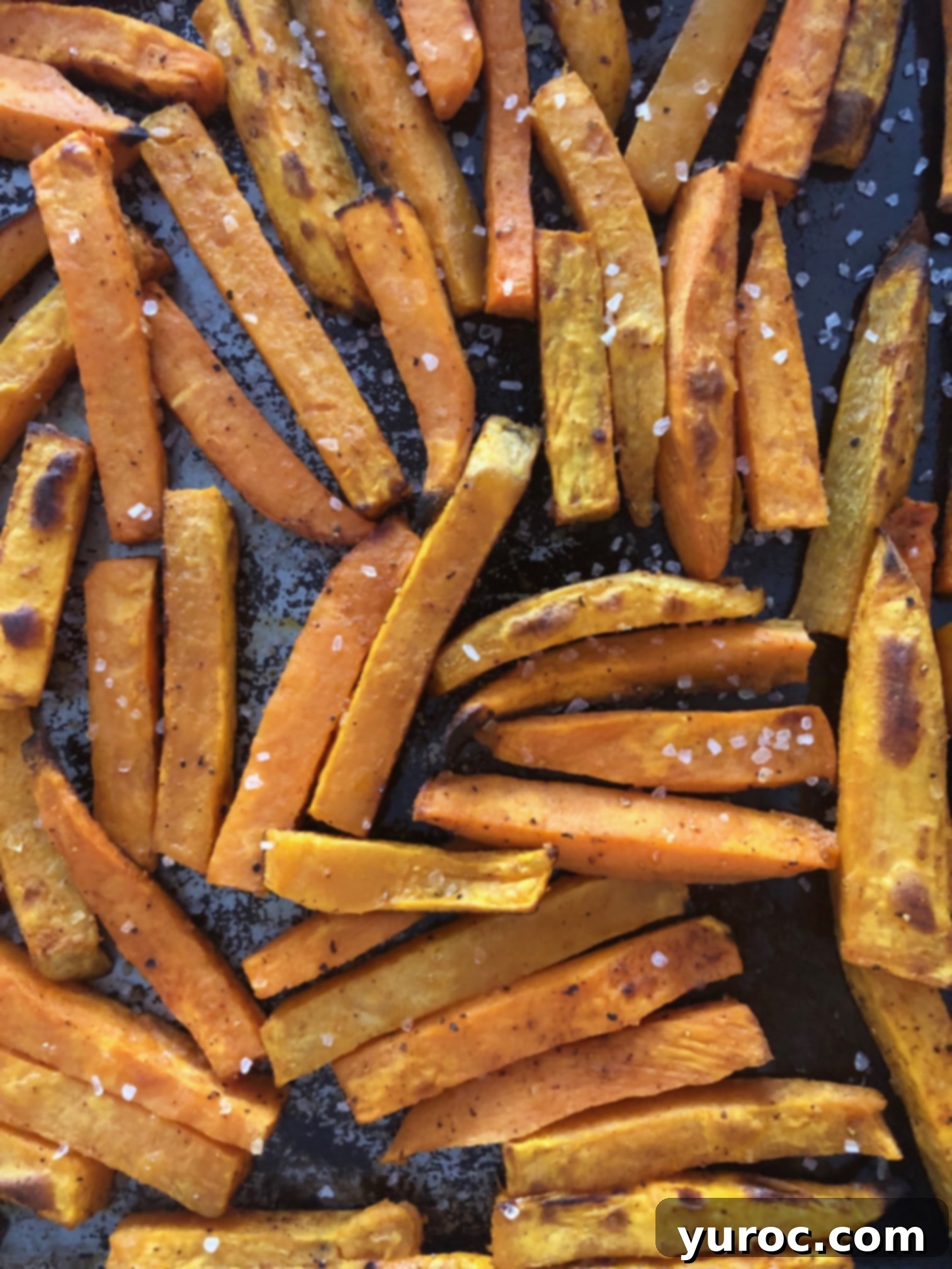 sweet potato fries cooked on baking sheet