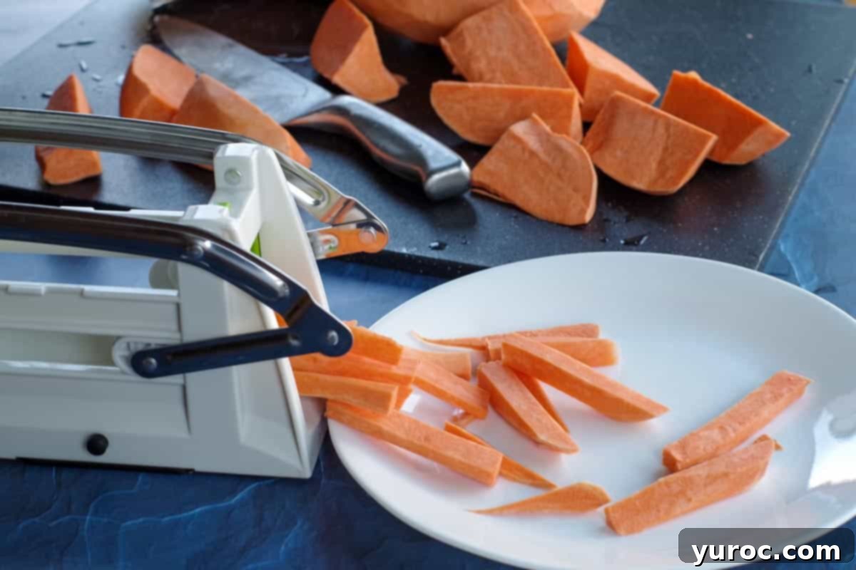 sweet potato fries being cut with a chipper
