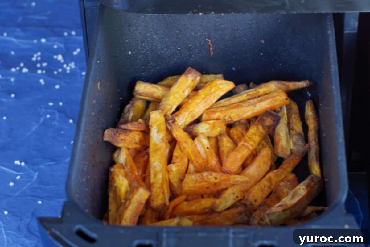 cooked sweet potato fries in drawer of air fryer