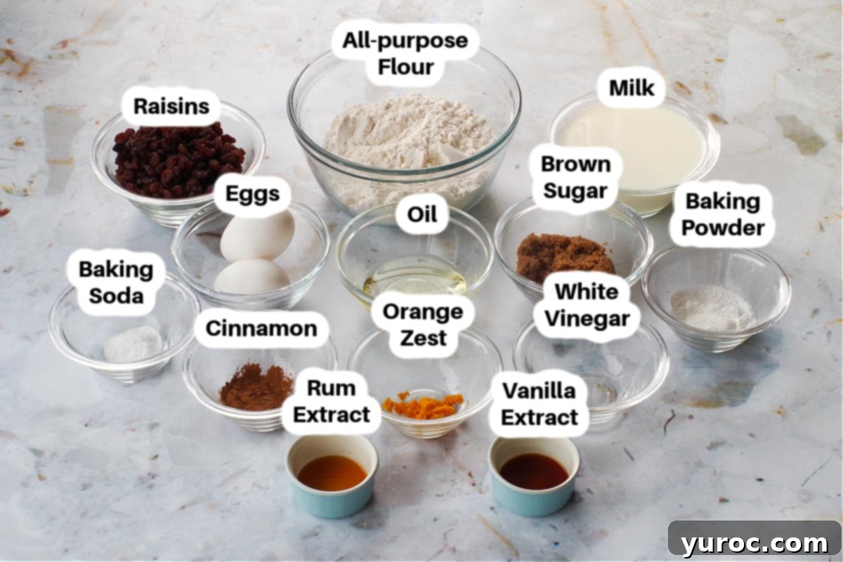 Neatly arranged ingredients for Rum and Raisin Sheet Pan Pancakes in glass bowls, clearly labeled for convenience.