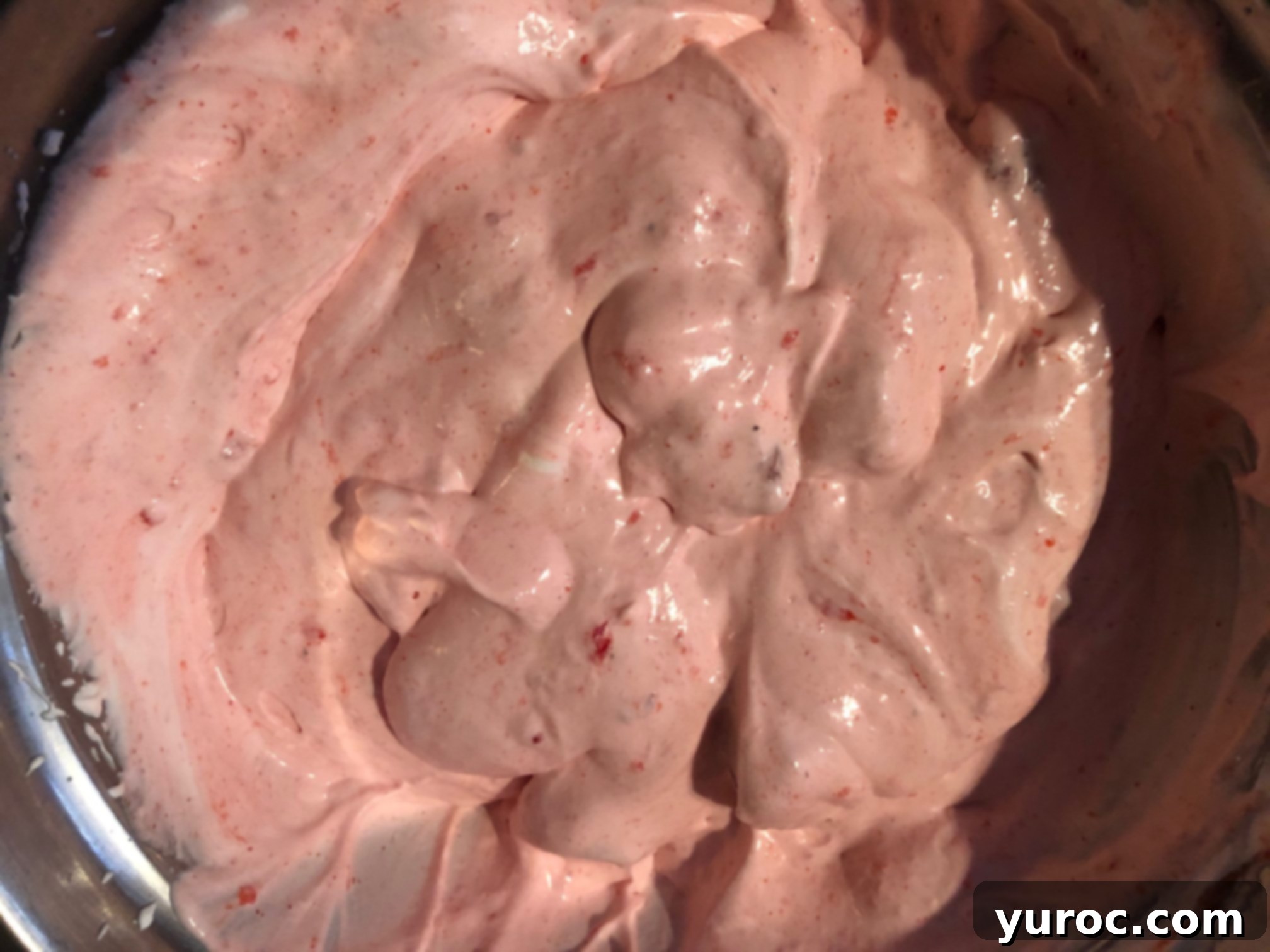 strawberry jello, strawberries and whipped cream mixed together