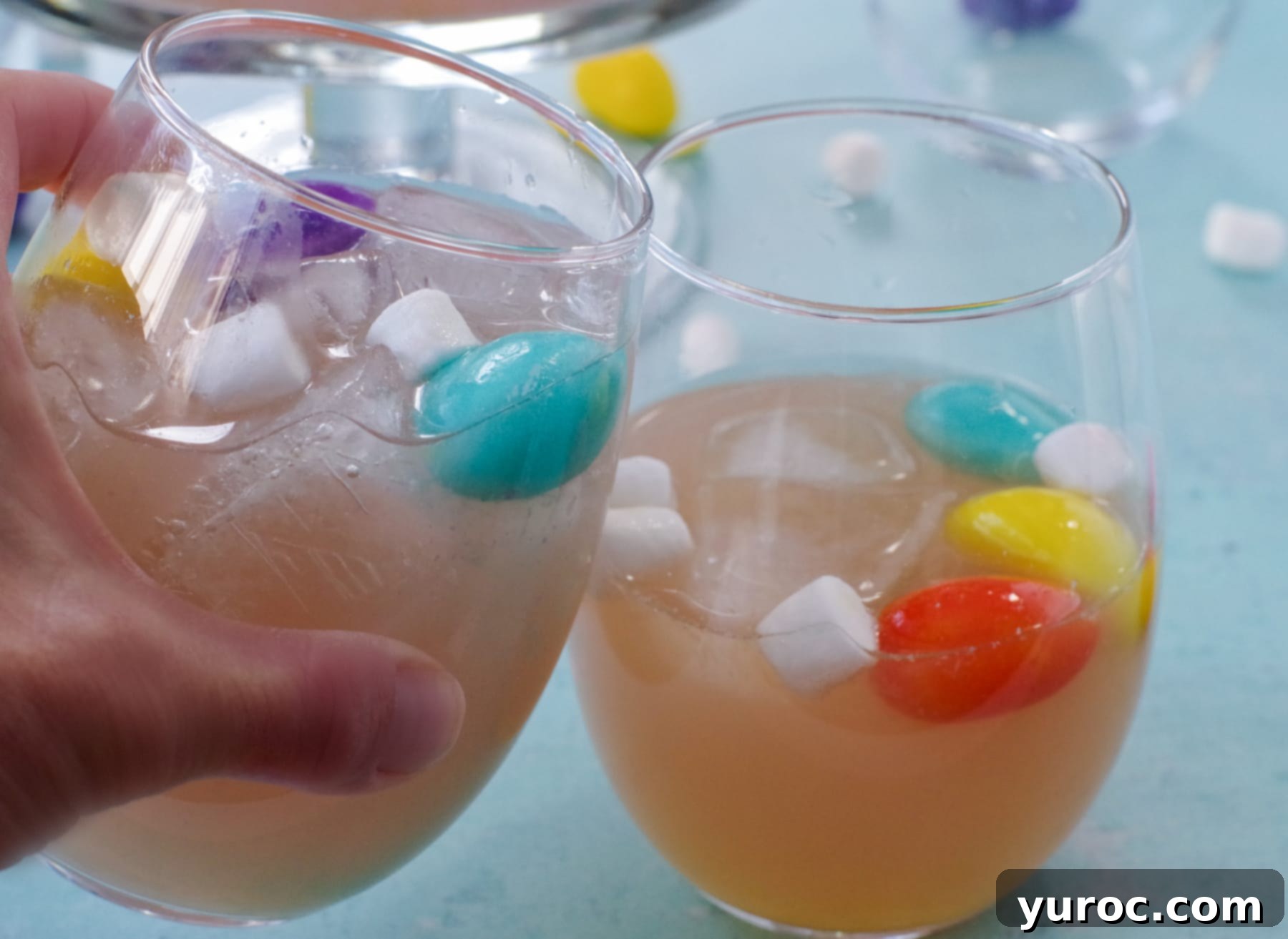 2 glasses with Easter punch clinking together