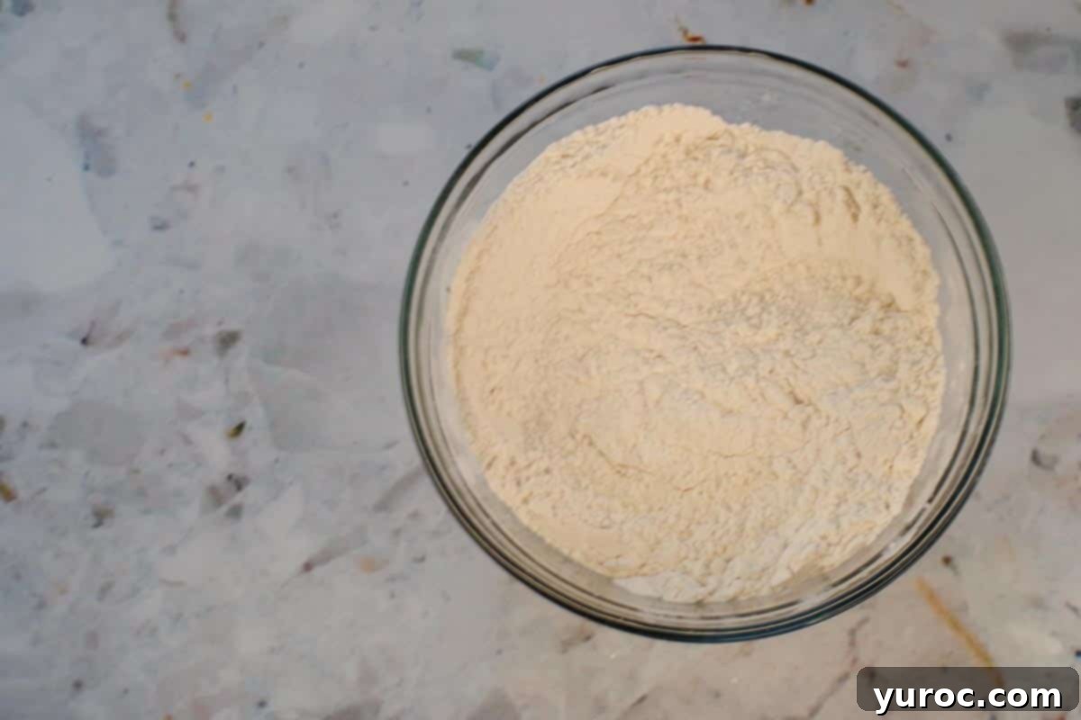 Dry ingredients sifted together in medium glass bowl.