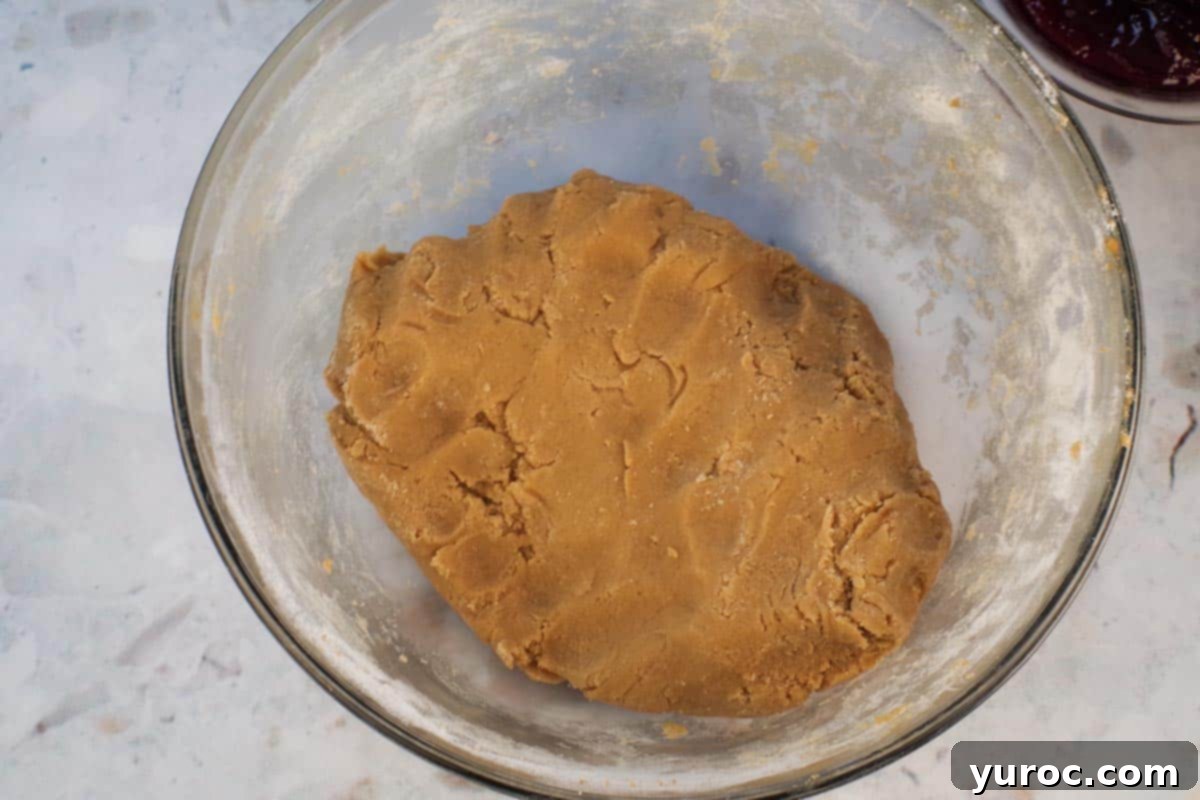 Hands used to work into dough that clings together.