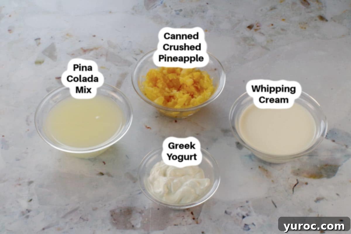 Cool & Creamy Virgin Pina Colada Pops 3 Four key ingredients for Piña Colada popsicles displayed in glass bowls: Piña Colada mix, whipping cream, Greek yogurt, and crushed pineapple.