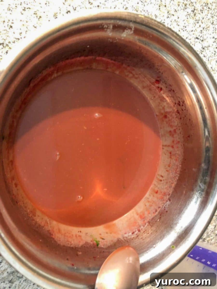 food coloring mixed in until desired color is achieved (in a stainless steel bowl)