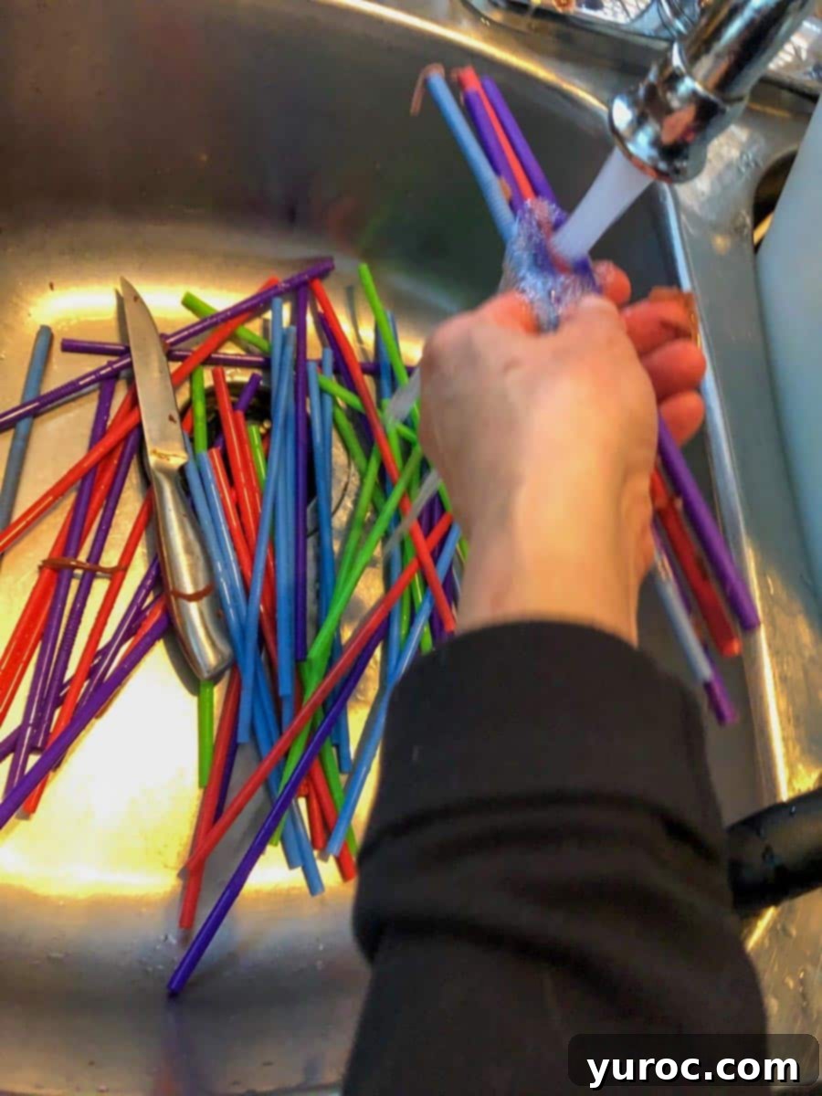 straws being rinsed in sink